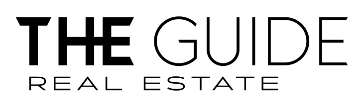 the guide real estate Logo